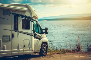 rv parked next to lake